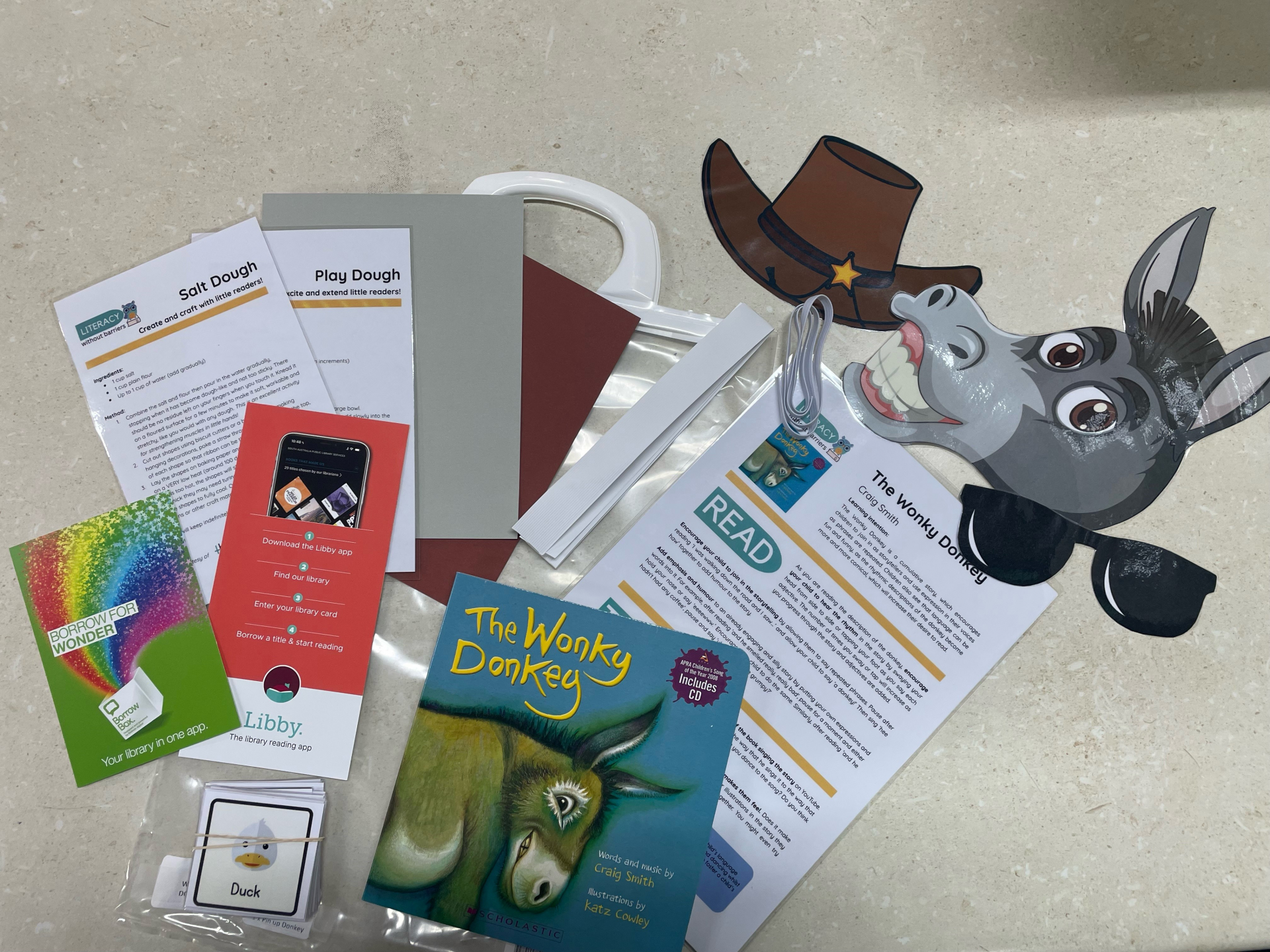 Image of the items in the literacy pack (flyers, books etc)