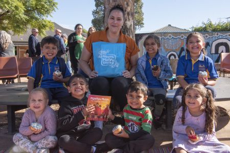 NgaityuMuiyuTantu_Launch - Lady reading a Kaurna book to children under a tree