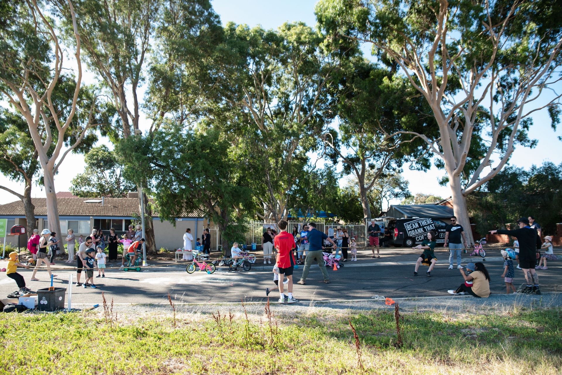 Image of people socialising and playing games on the street.