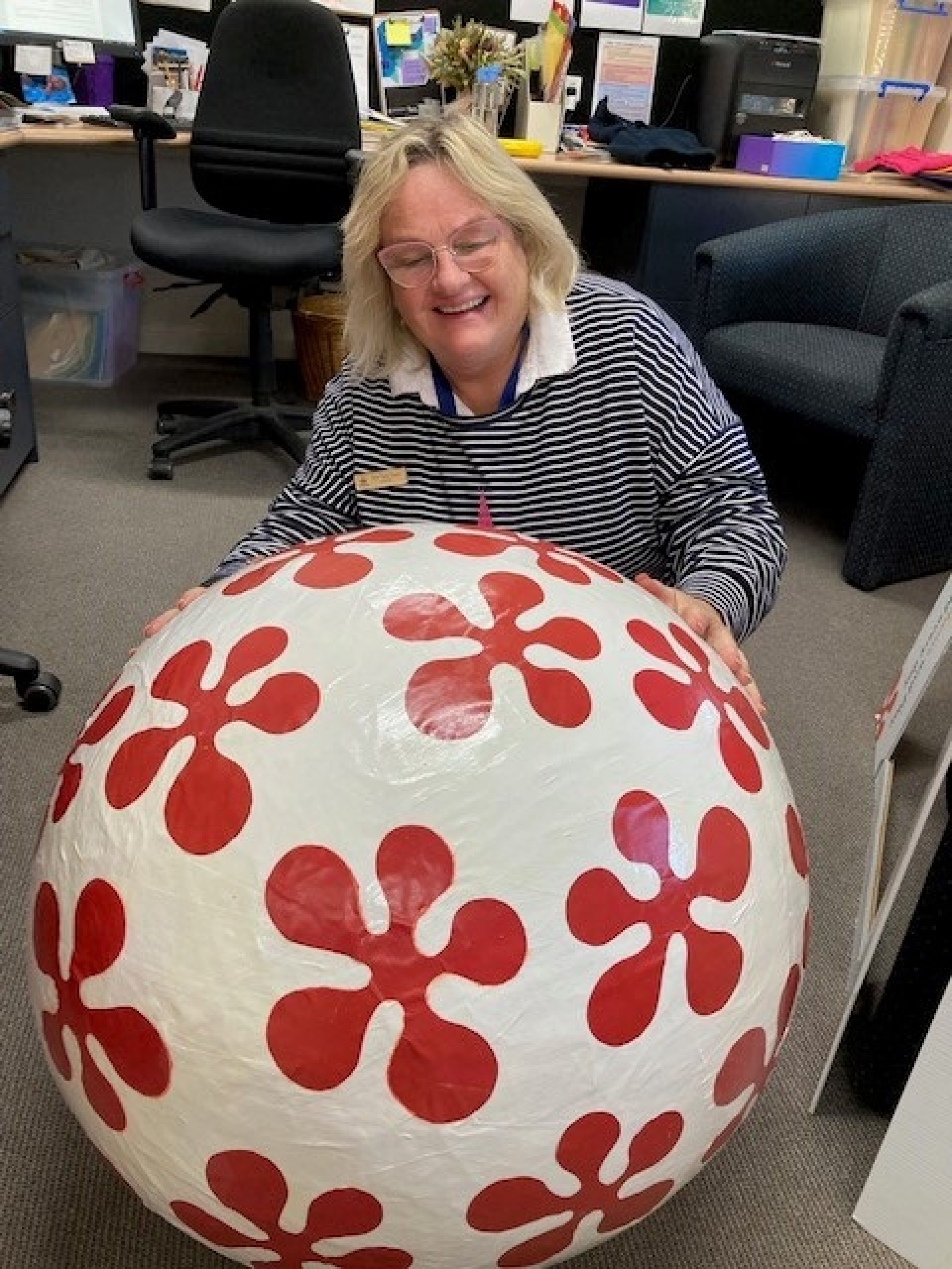 The big egg at the library - large white ball with red flower shapes on it.