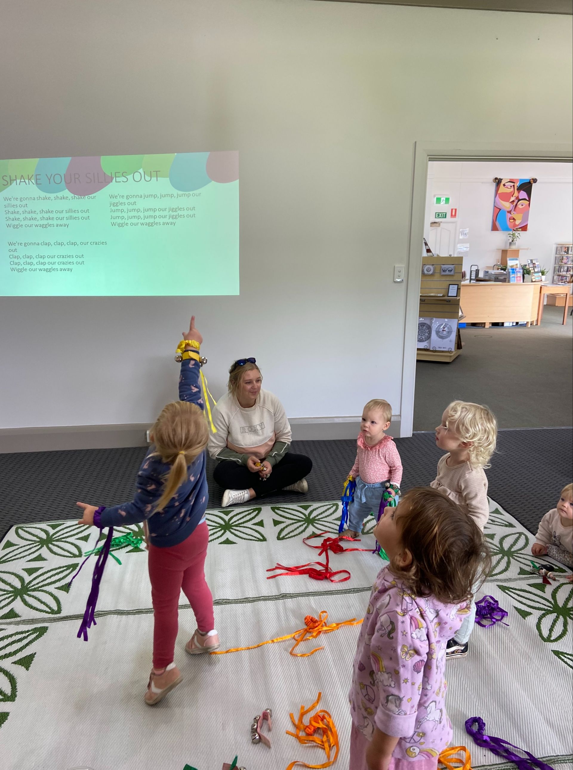 Young children listening to stories at the library